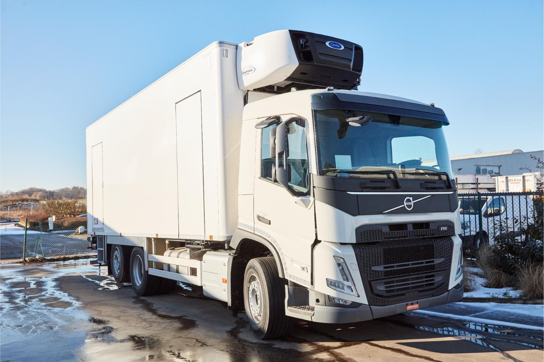 Volvo refrigerated truck with Carrier unit, three-quarter front view in our yard